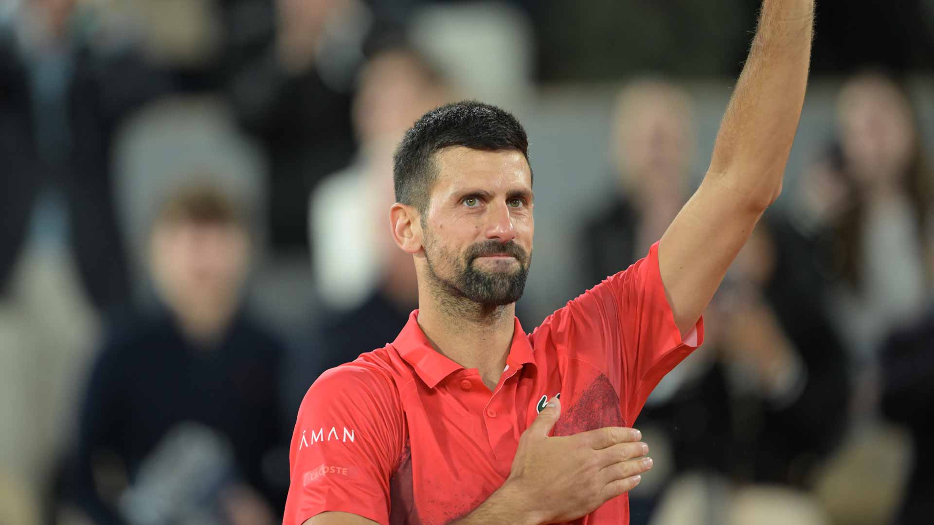 Novak Djokovic exits Court Philippe-Chatrier on Friday following his semi-final loss to Jannik Sinner.
