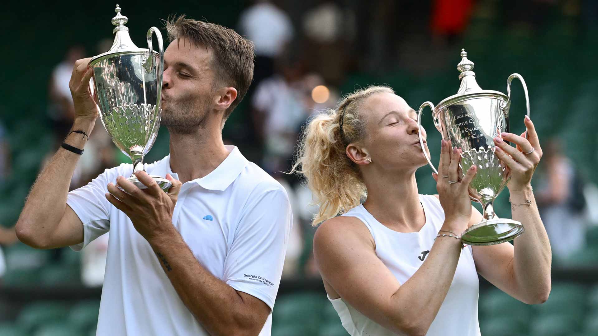 Sem Verbeek and Katerina Siniakova claim the Wimbledon mixed doubles trophy.