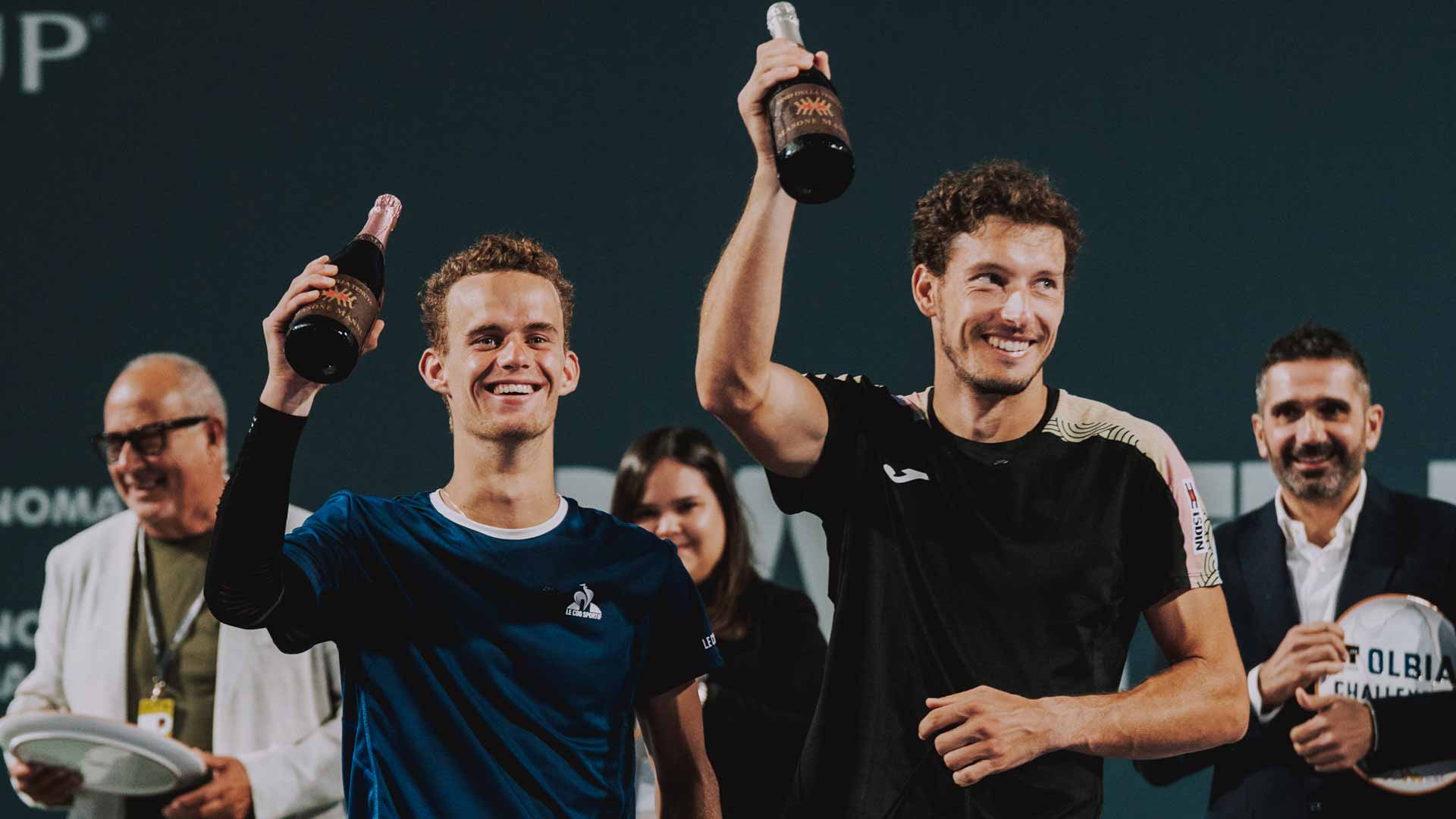 Luca Van Assche and Pablo Carreno Busta during the Olbia Challenger trophy ceremony.