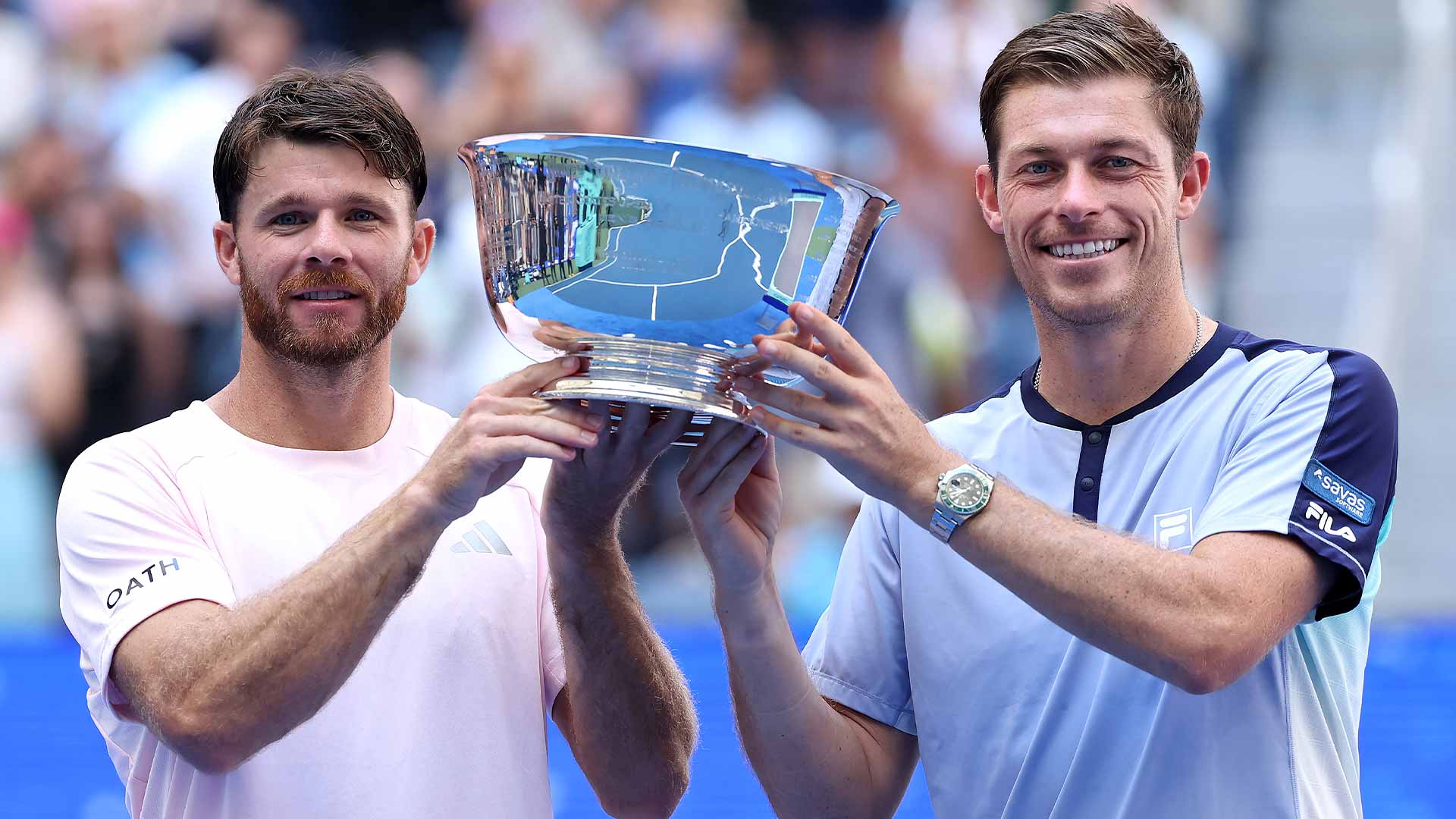 Christian Harrison and Neal Skupski lift the US Open men's doubles title Saturday in New York.