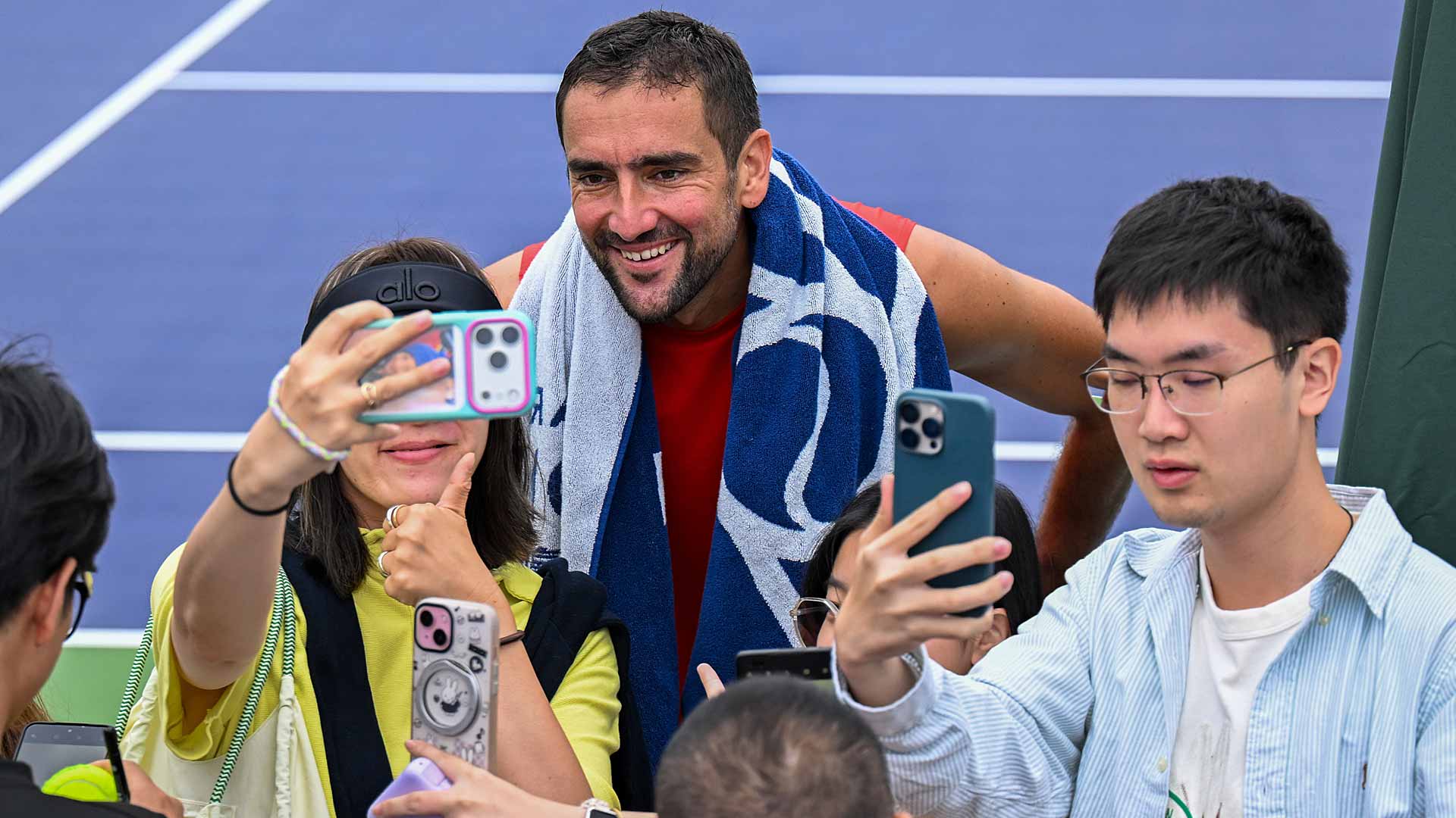 Fans get up close and personal with Marin Cilic.